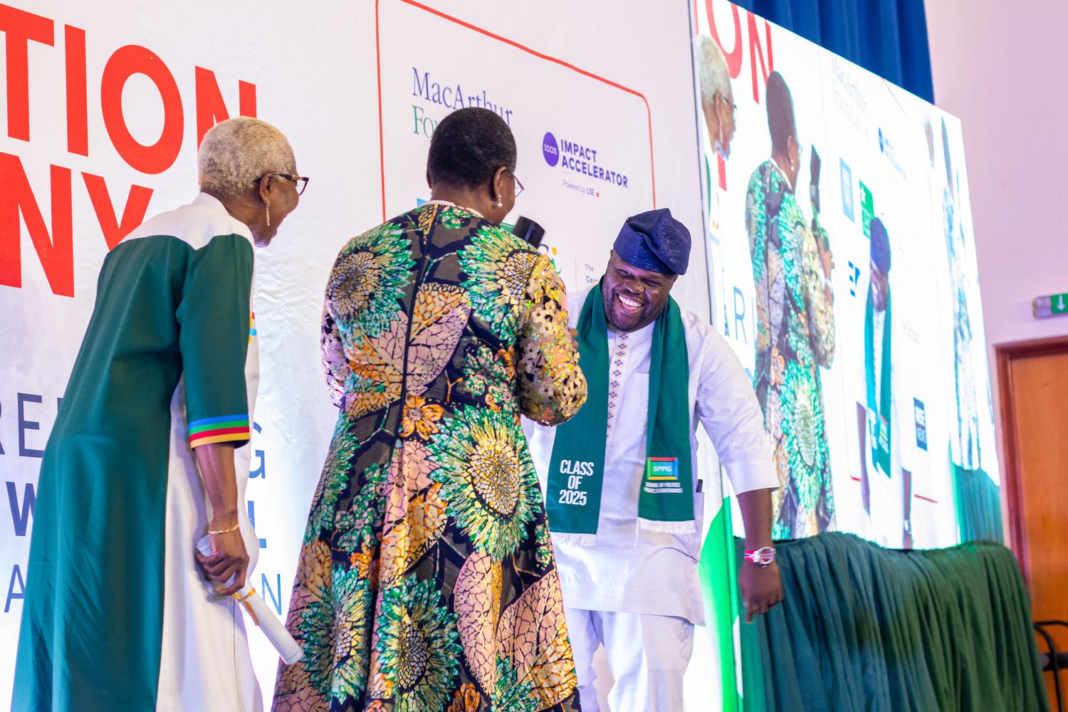 Dr Oby Ezekwesili congratulating a graduate on stage